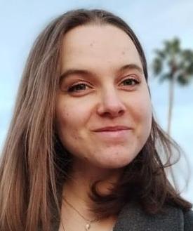 Photo of a young woman, smiling.